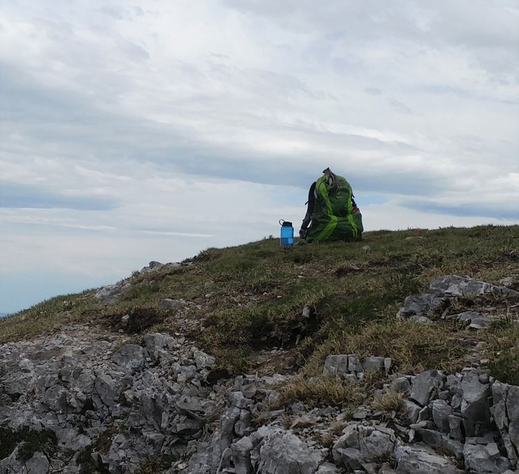 An image of a backpack at the summit of Prairie Mountain in Kananskis, Alberta