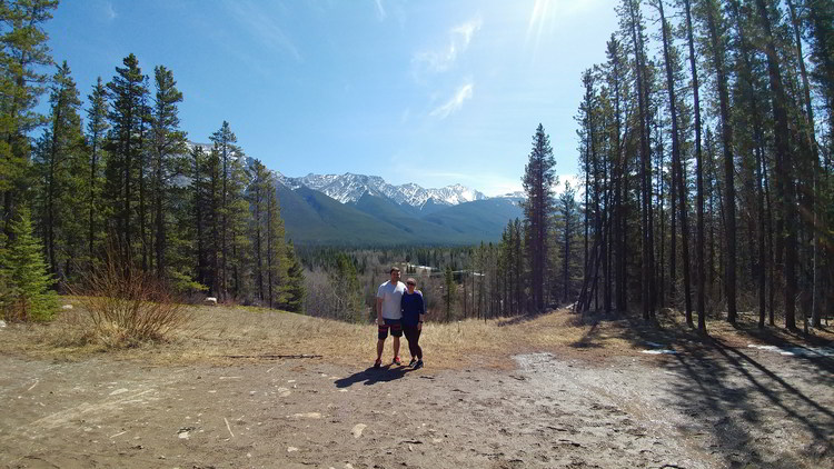 An image of a couple standing on the trail to Troll Falls in Kananaskis, Alberta