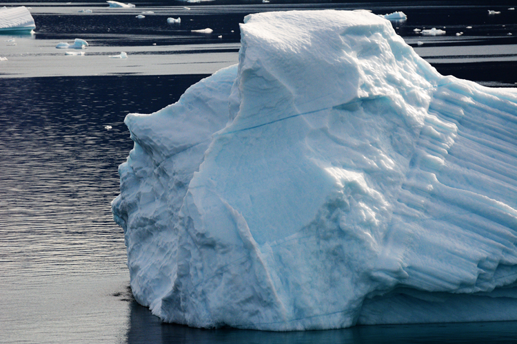 Image of a iceberg that looks like a face - iceberg pareidolia test