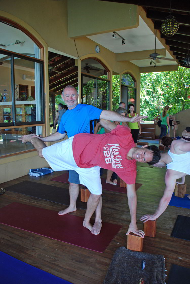A pair of men doing yoga at Anamaya Resort in Costa Rica - Yoga Retreat Costa Rica