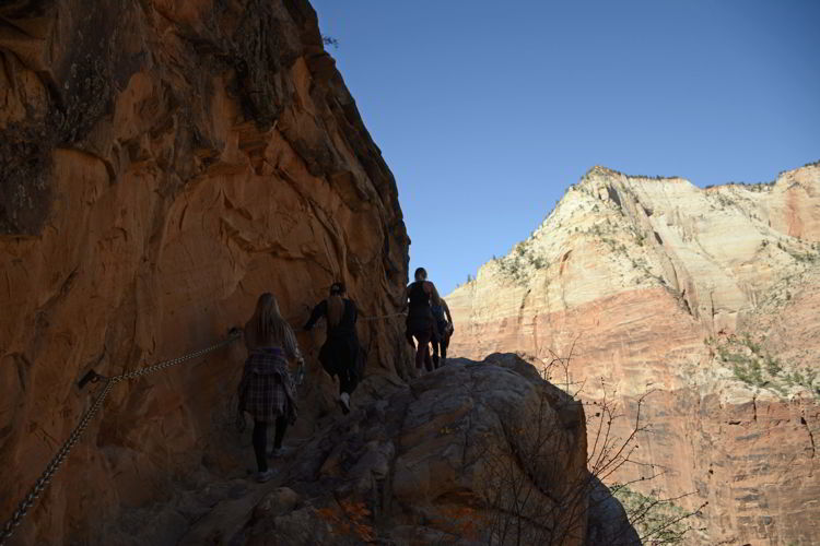 An image of a group of hikers heading up the trail to Hidden Canyon in Zion National Park in Utah - Best Zion National Park Hikes
