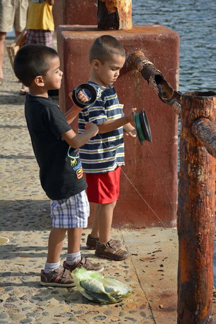 An image of two boys fishing in Yelapa - Jalisco, Mexico - Yelapa Beach