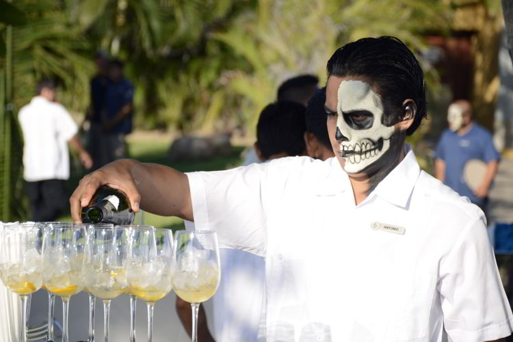 An image of a server with a skull painted on his face - Day of the Dead Festival -Dia de los Muertos 