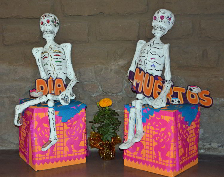 An image of two skeletons in a Day of the Dead Festival display - Dia de los Muertos