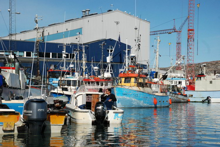 An image of boats in the Ilulissat Harbor in Ilulissat Greenland