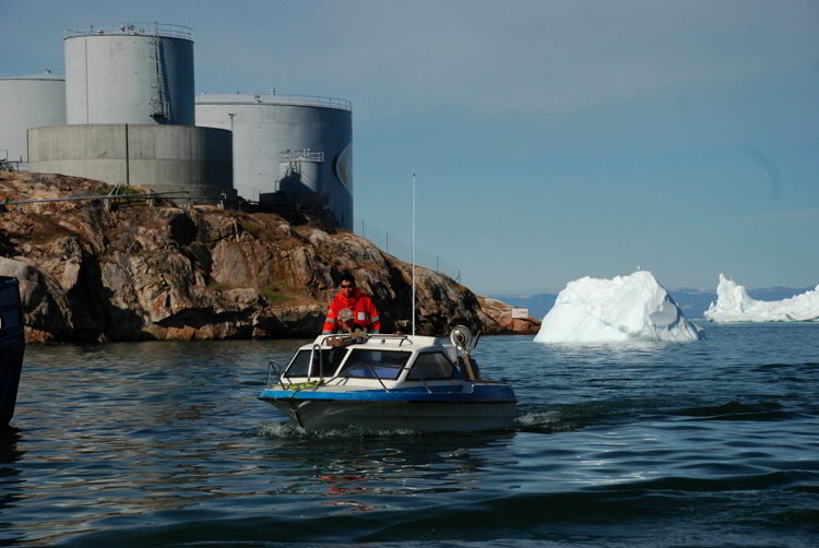 An image of a boat entering the harbor in Ilulissat, Greenland