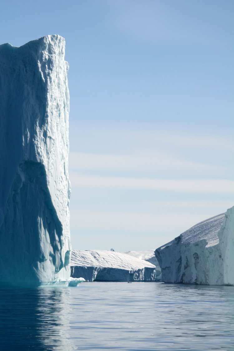 An image of three icebergs near Ilulissat Greenland