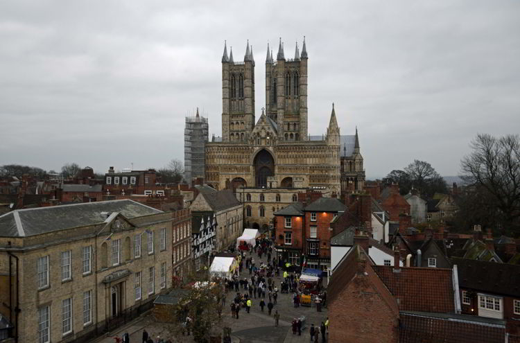 An image of Lincoln Cathedral and the Lincoln Christmas Market being set up in Lincolnshire, England.