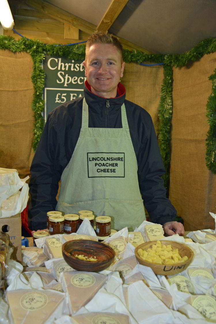 An image of a cheese vendor at the Lincoln Christmas market in Lincolnshire, England - best Christmas markets