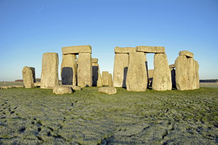 An image of Stonehenge bathed in morning light near Salisbury, UK - Stonehenge inner circle tours