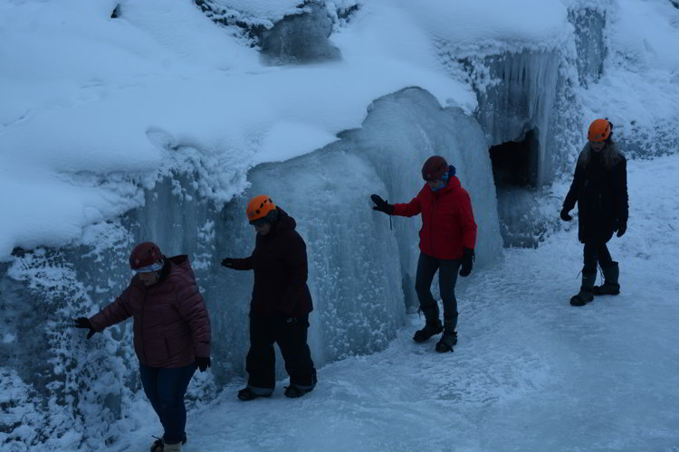 Image of a group of people doing an ice walk in the bottom of Maligne Canyon in Jasper National Park - Avoid the Winter Blues.