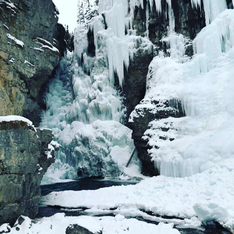 Image of an ice waterfall in Johnston Canyon in Banff National Park in Alberta - Avoid the Winter Blues
