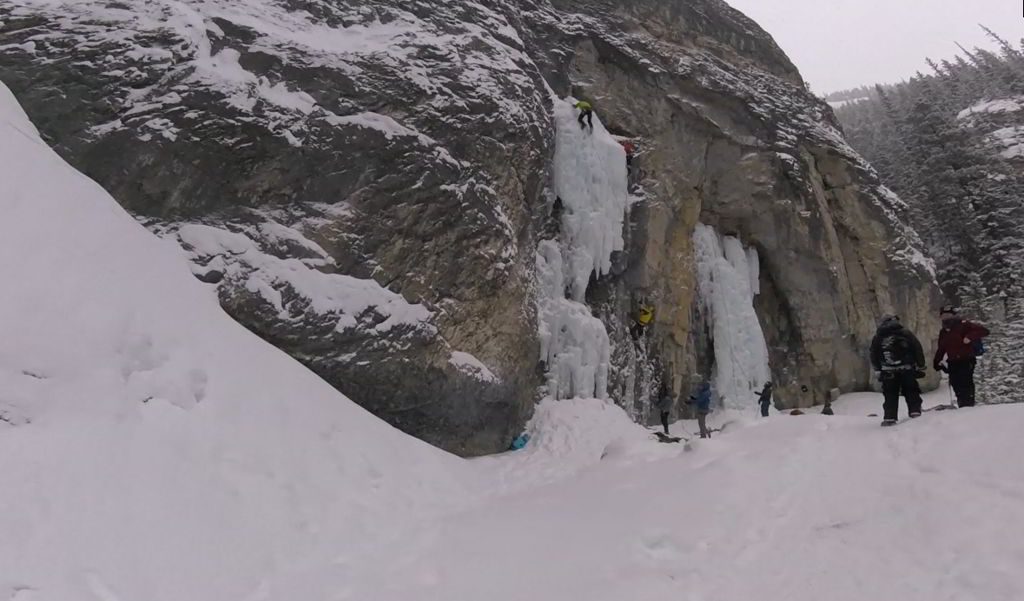 An image of frozen waterfalls and ice climbers on the Grotto Canyon hike near Canmore, Alberta