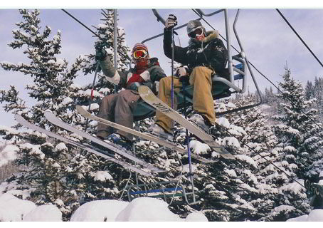 An image of two skiers riding a chairlift at Canyon Ski Resort in Red Deer - Things to do in Red Deer