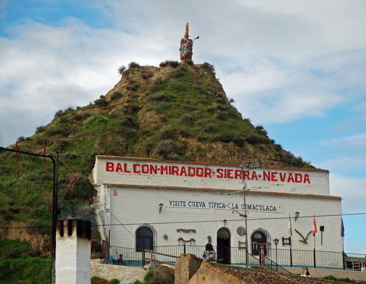 An image of a business operating out of a cave dwelling in Spain - Trafalgar Tours Europe