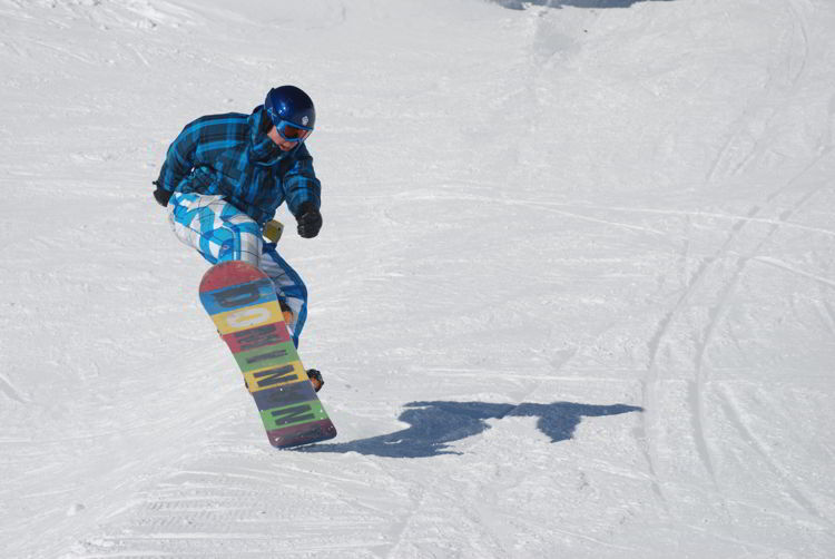 An image of a boy snowboarding at Canyon Ski Resort - things to do in Red Deer.