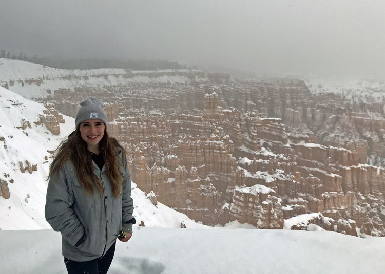 An image of a person standing in front of the Sunrise Point Overlook in Bryce Canyon National Park, Utah - Bryce Canyon in winter