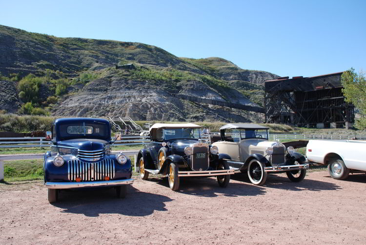 An image of some antique cars parked outside the Atlas Coal Mine near Drumheller, Alberta