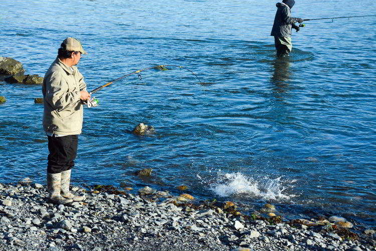 An image of two men fishing from shore in Seward, Alaska - Things to do in Seward, Alaska