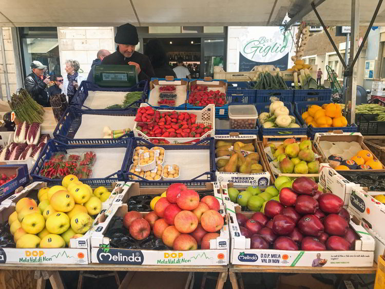 An image of a produce stand in the central market in Livorno, Italy.