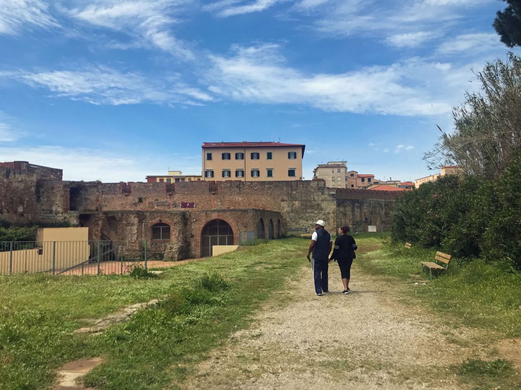 An image of a couple walking through Fortrezza Nuova in Livorno, Italy - exploring Livorno cruise port/