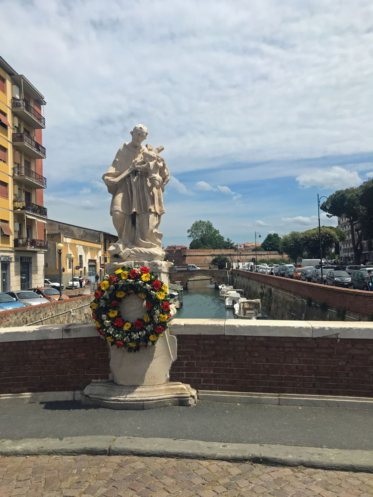 An image of a statue in Venezia Nuovo or New Venice in LIvorno, Italy.