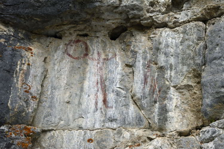 An image of the pictographs on the Grassi Lakes hike near Canmore, Alberta in the Canadian Rockies.