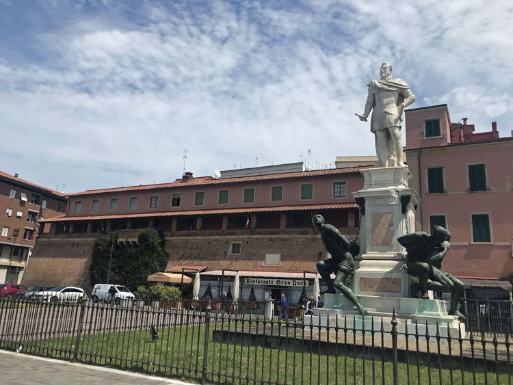 An image of a statue seen along Via Grande in Livorno, Italy - exploring Livorno cruise port. 
