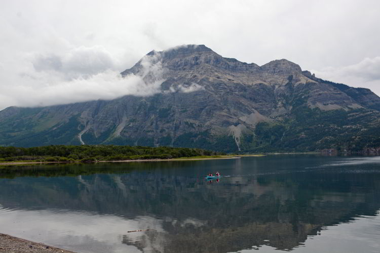 An image of a canoe on Upper Waterton Lake in Waterton Lakes National Park in Alberta, Canada. 