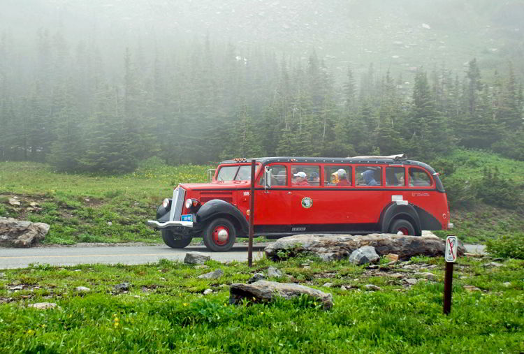 An image of the red bus tours in Glacier National Park. 