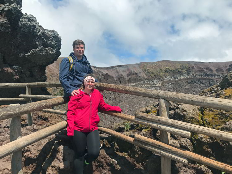 An image of two people standing near the caldera of Mount Vesuvius near Naples, Italy - Hiking Mt Vesuvius