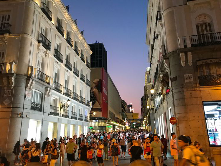 An image of a busy side street in Madrid, Spain.