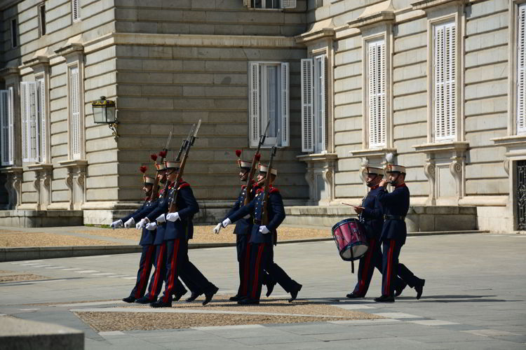 An image of the changing of the guard ceremony in front of the Royal Castle Madrid, Spain.