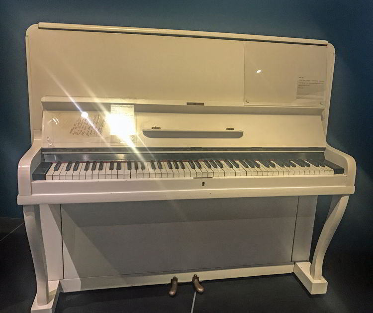 An image of Elton John's songwriting piano at Studio Bell in Calgary. 