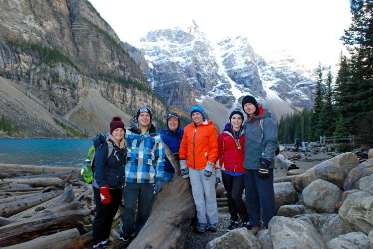 An image of a group of people standing in front of Moraine Lake in Banff National Park.