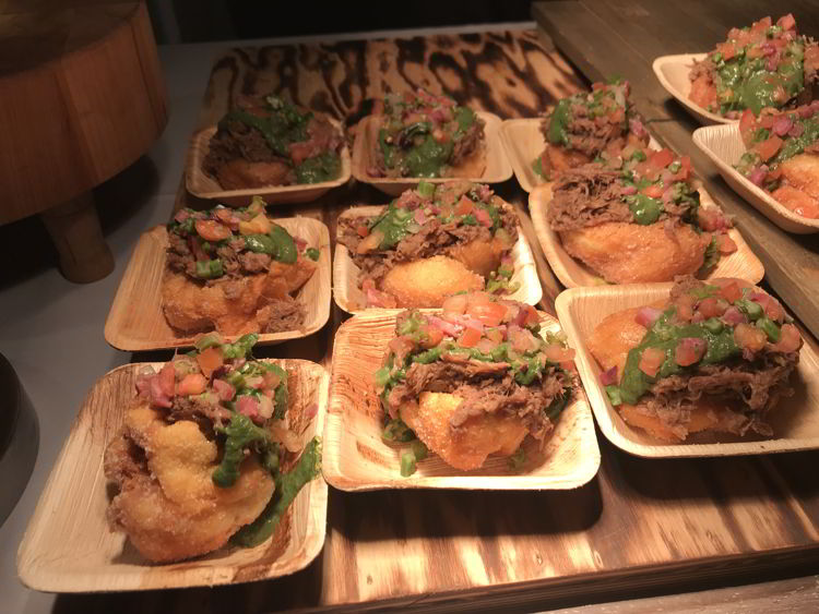 An image of a pulled pork malasada at the Hawaii Food and Wine Festival in Kāʻanapali, Maui.  