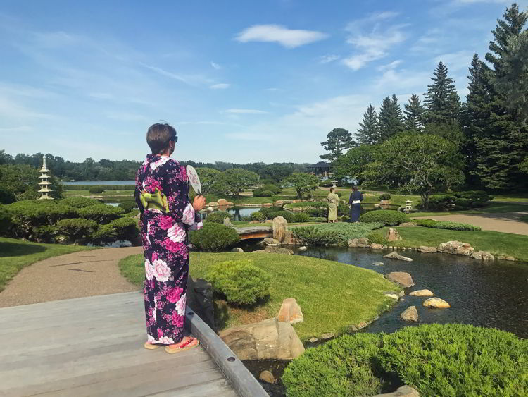 An image of someone in a standing in the Nikka Yuko Japanese Gardens - Things to do in Lethbridge, Alberta. 