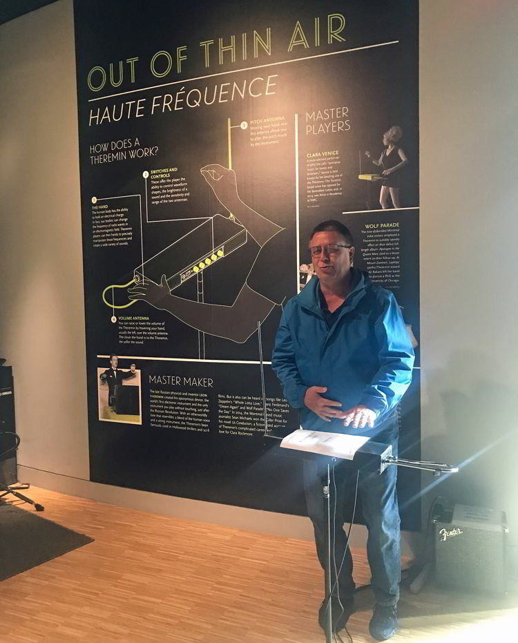 An image of a man playing the theremin at Studio Bell in Calgary, Alberta. 