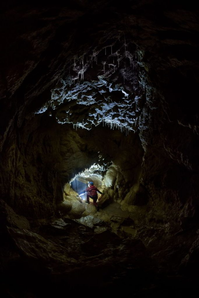 An image of a person inside the Rat's Nest Cave near Canmore, Alberta Canada.