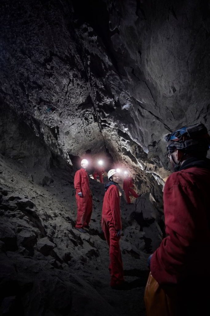 An image of a group of people on a Canmore Cave Tours in the Rat's Nest Cave in Canmore, Alberta. 