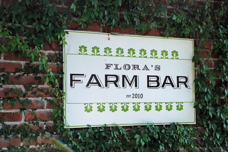 An image of the Flora Farms bar sign in Cabo San Lucas, Mexico.