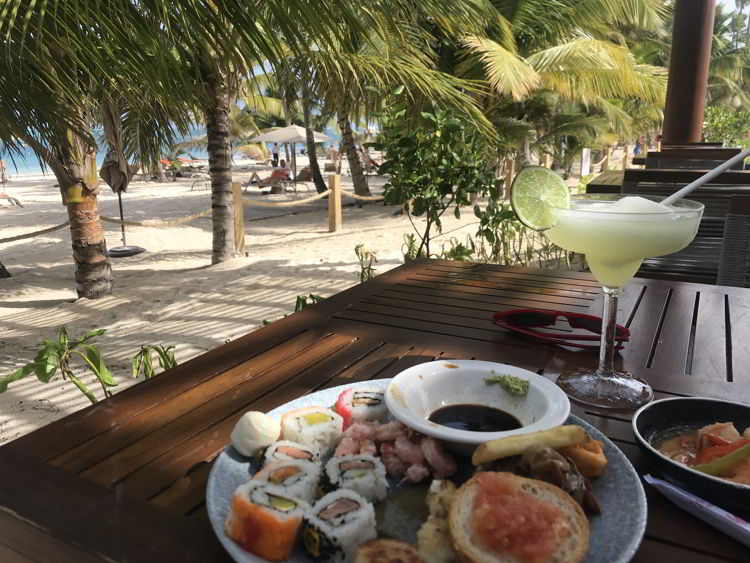 An image of the food and dining area at the Unique Club beach club area at Lopesan Costa Bavaro Resort in Punta Cana, Dominican Republic. 