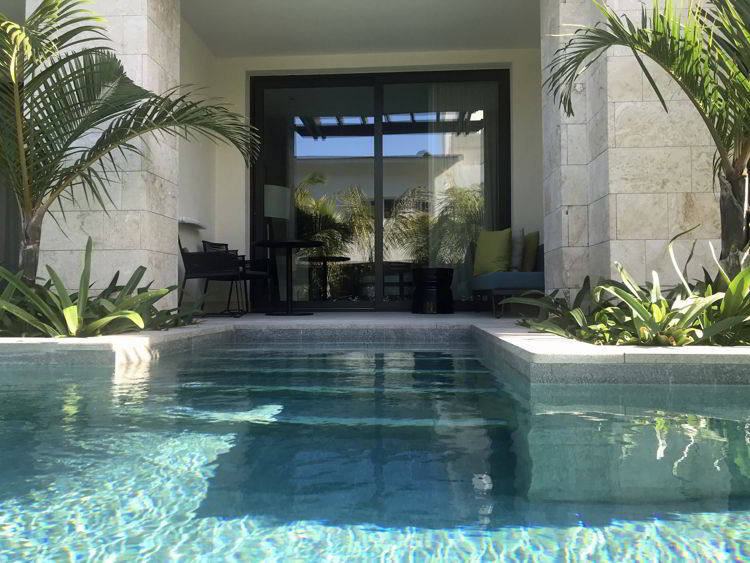 An image of the outside of the swim up junior suite at the Lopesan Costa Bavaro resort in Punta Cana, Dominican Republic. 