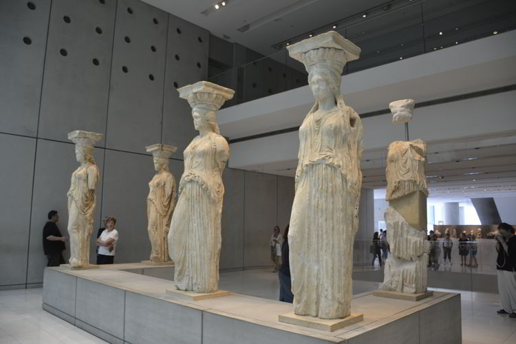 An image of statues in the Acropolis museum in Athens, Greece. 