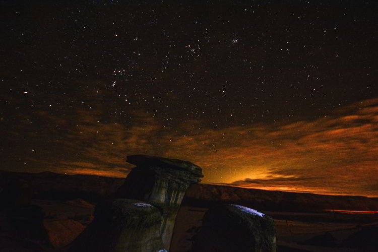 An image of the hoodoos near Drumheller, Alberta at night. 
