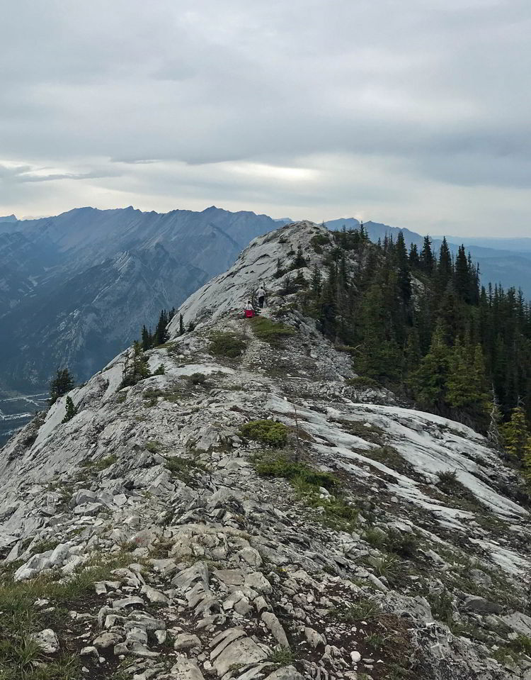 An image of the ridge walk between Grant MacEwan peak and the third unnamed peak on the Heart Mountain Horseshoe hike near Canmore, Alberta. 