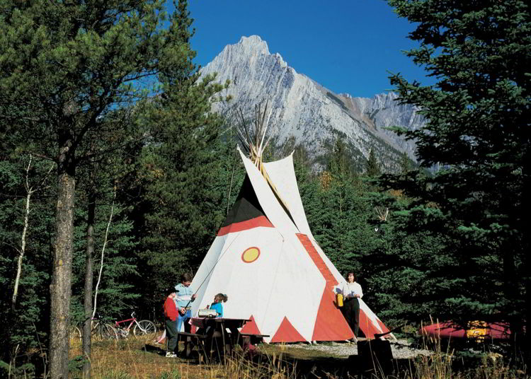 An image of the tipi accommodations at Sundance Lodges in Alberta, Canada. 