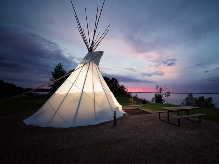 An image of a comfort camping tipi at Sir Winston Churchill Provincial Park in Alberta, Canada. 