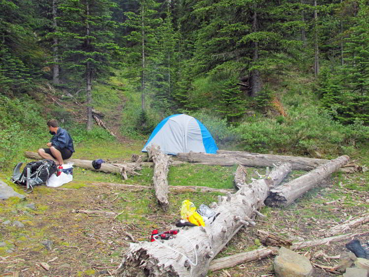 An image of a campsite on the shore of Allstones Lake in Alberta, Canada. 