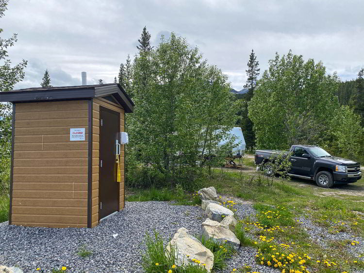 An image of the toilets beside Abraham Lake in Alberta, Canada. 